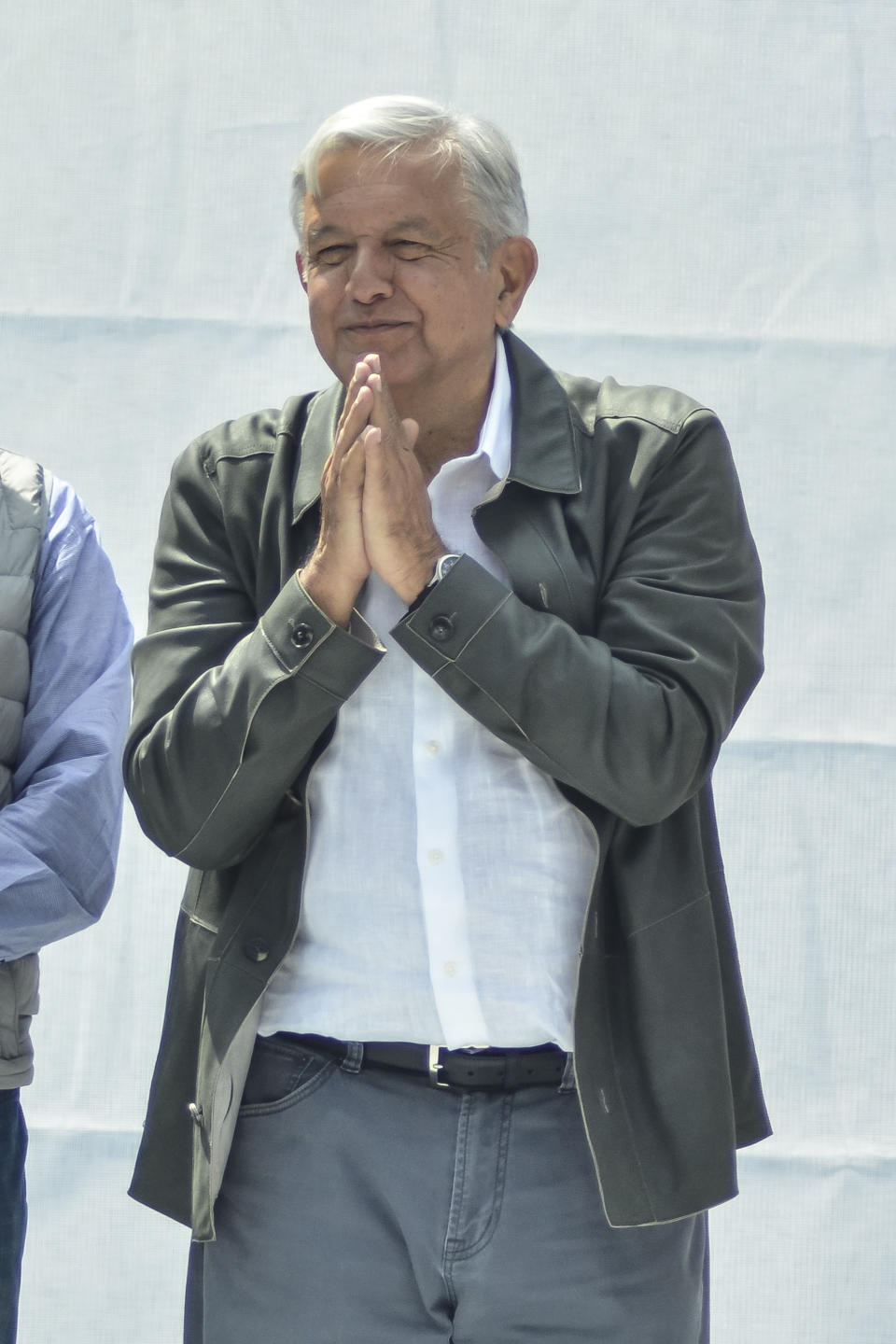 Mexico's President-elect Andres Manuel Lopez Obrador acknowledges the crowd at a rally commemorating the 50th anniversary of a bloody reprisal against students, at the Tlatelolco Plaza in Mexico City, Saturday, Sept. 29, 2018. Lopez Obrador vowed Saturday to never use military force against civilians. Troops fired on a peaceful demonstration at the plaza on Oct. 2, 1968, killing as many as 300 people at a time when leftist student movements were taking root throughout Latin America. (AP Photo/Christian Palma)