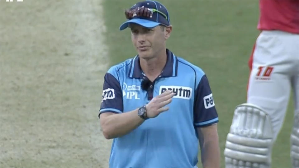 Umpire Chris Gaffaney, pictured here signalling the four.