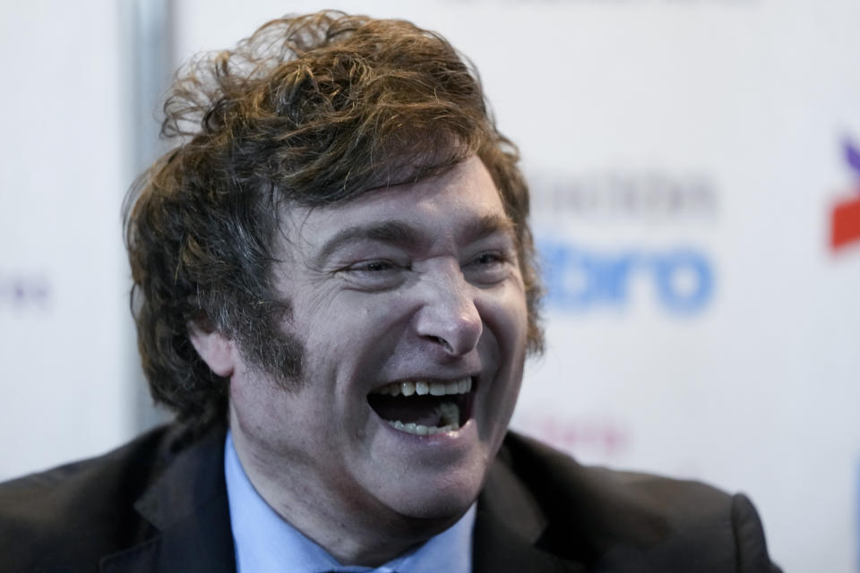 Argentina presidential candidate Javier Milei laughs after presenting his book "The End of Inflation" at the Buenos Aires book fair in Buenos Aires, Argentina, Sunday, May 14, 2023. (AP Photo/Natacha Pisarenko)