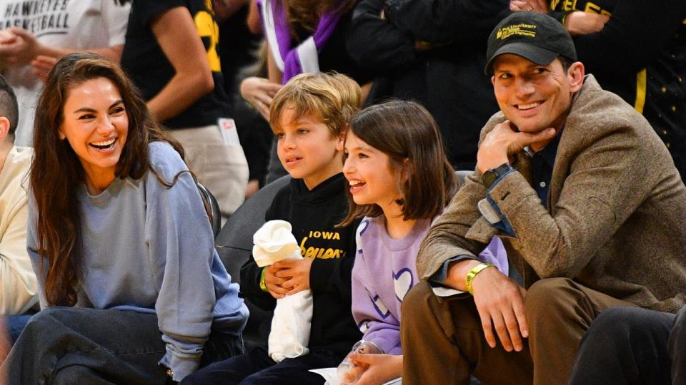 Mila Kunis and Ashton Kutcher and their children. Photo by Brian Rothmuller/Icon Sportswire via Getty Images.