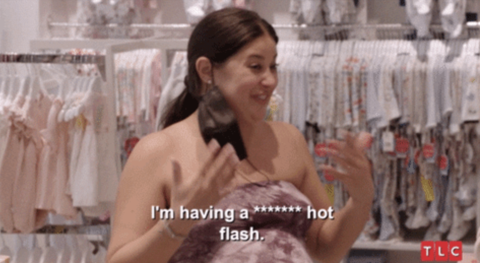 A screencap from TLC's "90 Day Fiance" with Loren Brovarnik expressing, "I'm having a hot flash"