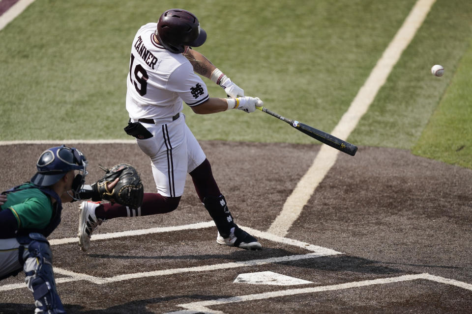 Mississippi State's Logan Tanner (19) hits a seventh inning home run against Notre Dame during an NCAA college baseball super regional game, Saturday, June 12, 2021, in Starkville, Miss. Mississippi State won 9-8. (AP Photo/Rogelio V. Solis)