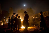 <p>Ultra-Orthodox Jews stand next to bonfires during Lag Ba’Omer celebrations, in Bnei Brak, Israel, Saturday, May 13, 2017. Jews celebrate Lag Ba’Omer to commemorate the end of a plague said to have decimated Jews in Roman times. (Photo: Oded Balilty/AP) </p>