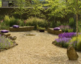 <p> In Mediterranean garden ideas gravel is often interspersed with rocks and a natural planting scheme that combines different colors and textures. </p> <p> If you like the idea, try introducing a variety of plants that work well landscaped with gravel and rocks. Many plants are happy to settle their roots straight into gravel. Any gaps will soon be colonised by self-seeding plants that will help your landscaping design evolve smoothly from year to year with very little input from you. </p> <p> Try drifts of hardy and low-growing plants including lavender, herbs and succulents, then try landscaping with grasses to create a naturalistic look too.&#xA0; </p>