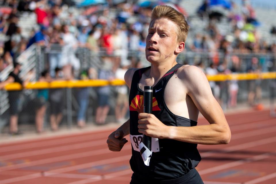 Red Mountain High School Freshmen Tyler Mathews runs in the 4X800 meter relay at the Division 1 State Track & Field Championships at Desert Vista High School in Phoenix, Ariz. on May 12, 2021. 