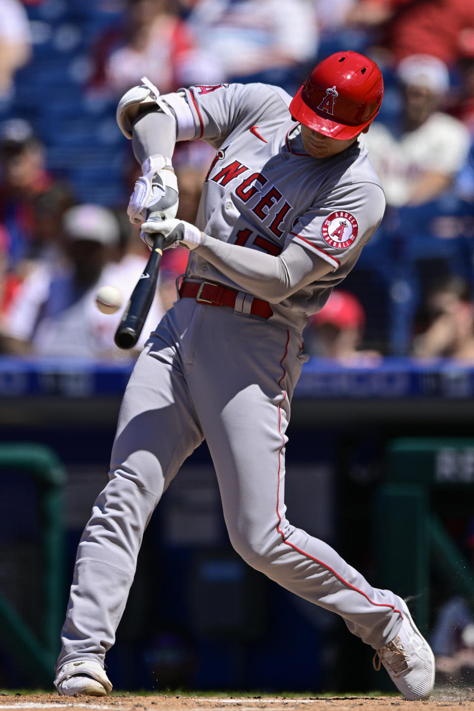 Los Angeles Angels' Shohei Ohtani hits a double off Philadelphia Phillies starting pitcher Kyle Gibson during the fourth inning of a baseball game, Sunday, June 5, 2022, in Philadelphia. (AP Photo/Derik Hamilton)