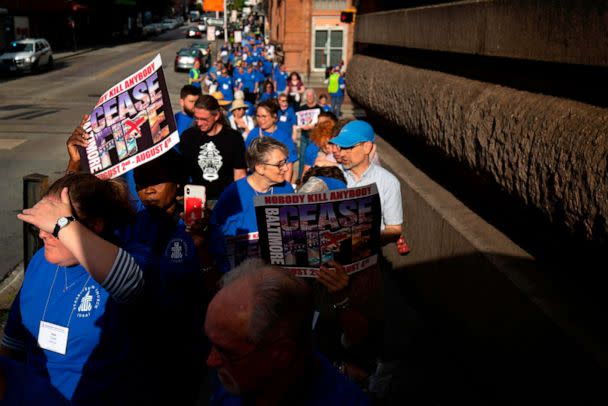 PHOTO: People take part in a Baltimore Ceasefire 'peace walk' to push for a 72-hour weekend period without any homicides and commemorate victims of gun violence in Baltimore, Maryland, on August 2, 2019. (Alastair Pike/AFP via Getty Images, FILE)