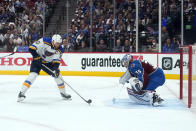 St. Louis Blues center Ryan O'Reilly (90) scores a goal against Colorado Avalanche goaltender Darcy Kuemper during the first period in Game 1 of an NHL hockey Stanley Cup second-round playoff series Tuesday, May 17, 2022, in Denver. (AP Photo/Jack Dempsey)