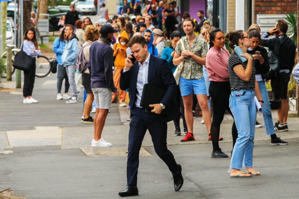 People are seen lining up at Centrelink in Bondi Junction on March 23, 2020 in Sydney, Australia. The jobs market won't recover for several years, independent economist Stephen Koukoulas has said. (Photo by Jenny Evans/Getty Images)