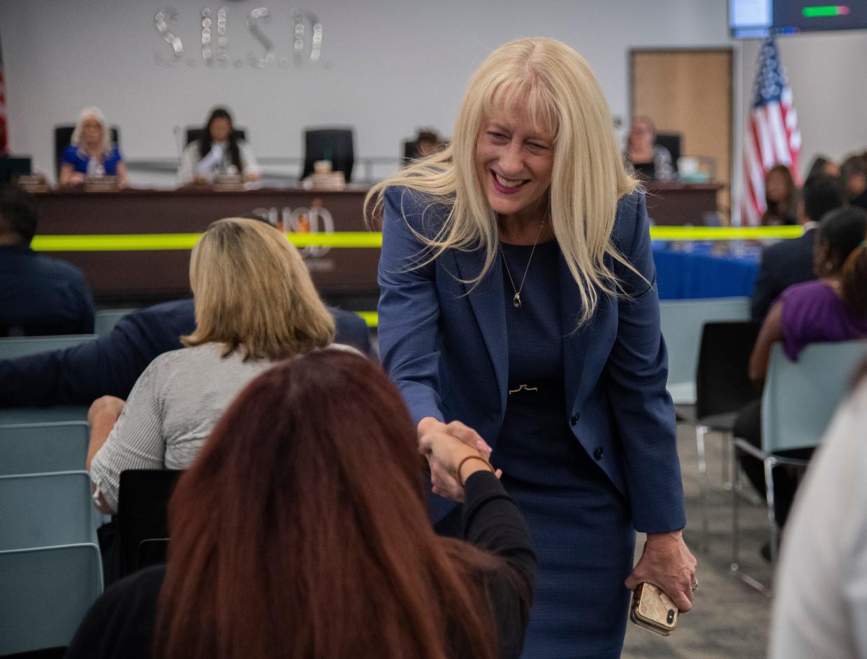 Newly named Stockton Unified School District superintendent Michelle Rodriguez, right, talks with parent Monique Guerrero before a SUSD board meeting in downtown Stockton.