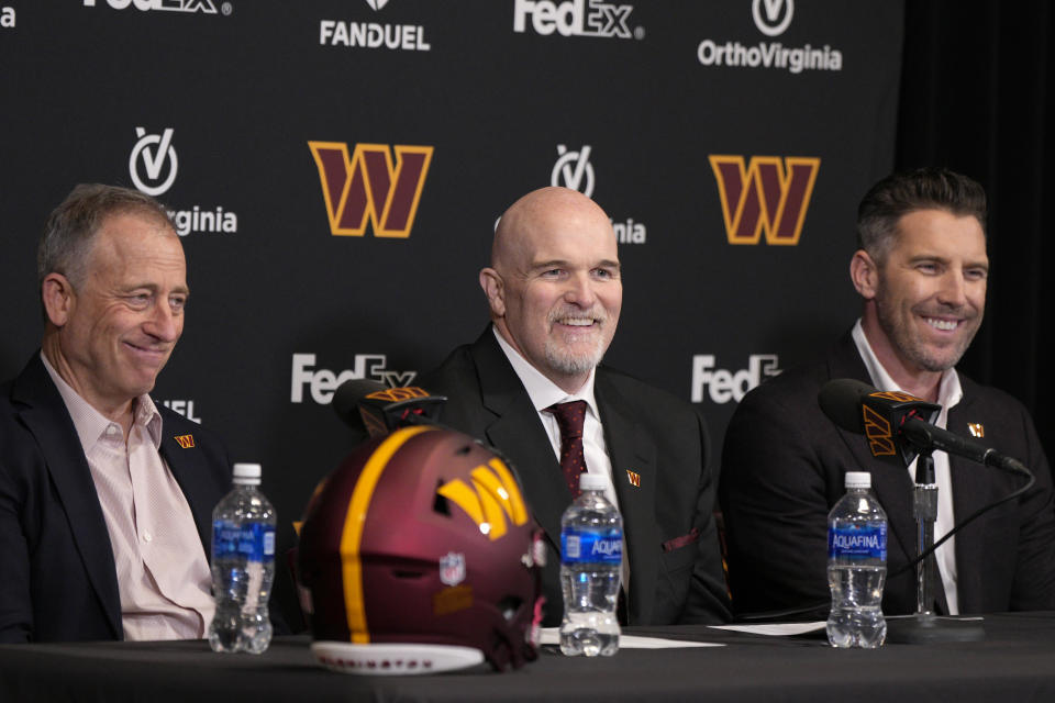 Head coach Dan Quinn of the Washington Commanders speaks during a press conference alongside managing partner Josh Harris, left, and general manager Adam Peters. (Photo by Jess Rapfogel/Getty Images)