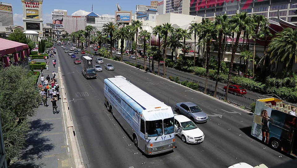 The Hangover Heaven bus makes its way down Las Vegas Boulevard to pick up a patient at a Strip casino, Sunday, April 15, 2012, in Las Vegas. The bus picked up 16 patients on its first weekend as a mobile treatment center for tourists who spent the night before drinking in all the nightlife Las Vegas has to offer. For a fee, they get a quick morning-after way to rehydrate, rejuvenate and resume their revelry.  (AP Photo/Julie Jacobson)