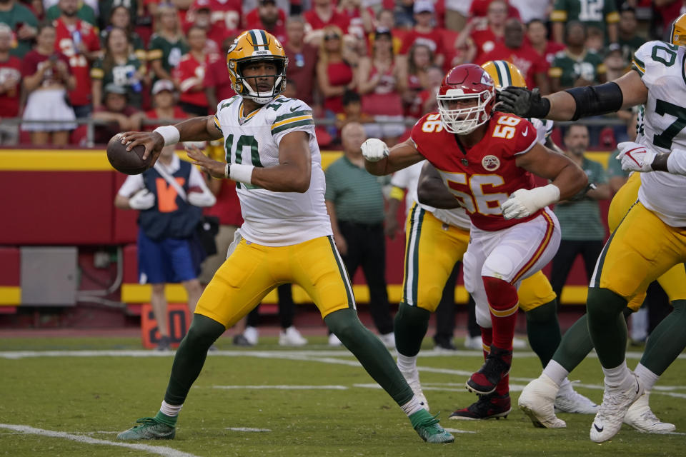 Green Bay Packers quarterback Jordan Love (10) throws as Kansas City Chiefs defensive end George Karlaftis (56) defends during the first half of an NFL preseason football game Thursday, Aug. 25, 2022, in Kansas City, Mo. (AP Photo/Ed Zurga)