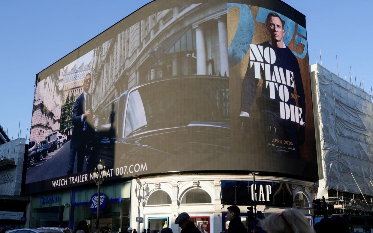 The trailer for No Time Die being shown at Piccadilly Circus in London, December 2019 - Reuters