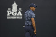 Tiger Woods lines up a putt on the 12th hole during the first round of the PGA Championship golf tournament, Thursday, May 19, 2022, in Tulsa, Okla. (AP Photo/Eric Gay)