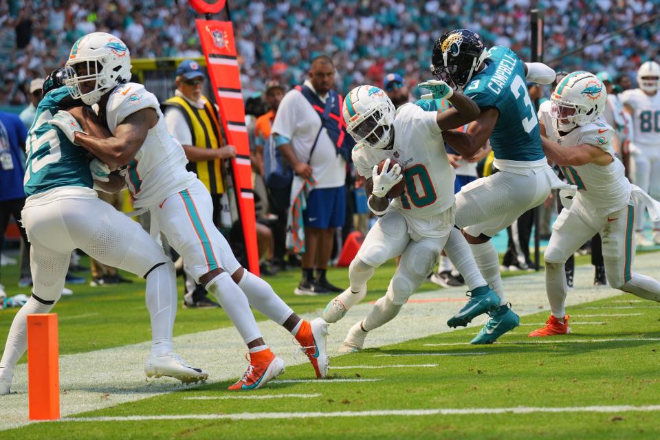 Sep 8, 2024; Miami Gardens, Florida, USA; Jacksonville Jaguars cornerback Tyson Campbell (3) drives Miami Dolphins wide receiver Tyreek Hill (10) out of bounds in the second quarter at Hard Rock Stadium. Mandatory Credit: Jim Rassol-Imagn Images