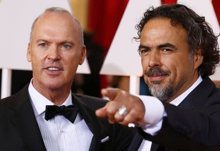 Michael Keaton (L), nominated for Best Actor for the film "Birdman" and Alejandro Gonzalez Inarritu, nominated for Best Director for the same film, arrive at the 87th Academy Awards in Hollywood, California February 22, 2015. REUTERS/Lucas Jackson