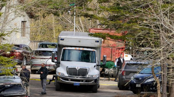 PHOTO: A body is wheeled to a hearse at the scene of a shooting, April 18, 2023, in Bowdoin, Maine. (Robert F. Bukaty/AP)