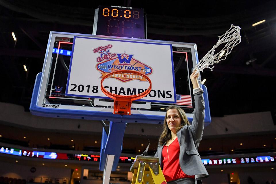 Gonzaga Bulldogs head coach Lisa Fortier celebrates after cutting the net against the San Diego Toreros after the championship game of the West Coast Conference tournament at Orleans Arena on March 6, 2018.