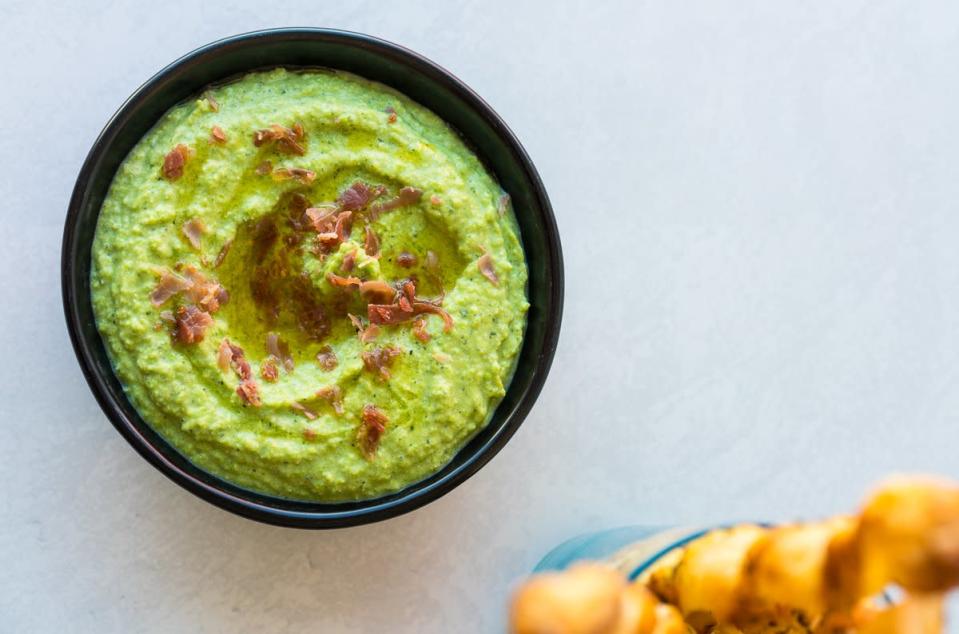 <p>Alison Ashton</p><p>This dip is filled with spring flavors and is also great as a sandwich spread.</p><p><strong>Get the recipe: <a href="https://parade.com/731092/parade/spring-pea-dip-with-prosciutto/" rel="nofollow noopener" target="_blank" data-ylk="slk:Spring Pea Dip with Prosciutto;elm:context_link;itc:0;sec:content-canvas" class="link ">Spring Pea Dip with Prosciutto</a></strong></p><p><strong>Related: <a href="https://parade.com/845209/felicialim/21-savory-spring-pea-recipes-youll-absolutely-love/" rel="nofollow noopener" target="_blank" data-ylk="slk:Savory Spring Pea Recipes;elm:context_link;itc:0;sec:content-canvas" class="link ">Savory Spring Pea Recipes</a></strong></p>