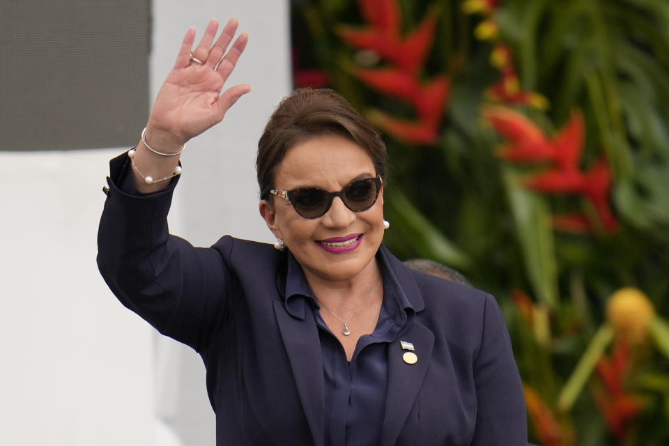 FILE - Honduras' President Xiomara Castro waves during the swearing-in ceremony for Colombia's President Gustavo Petro in Bogota, Colombia, Sunday, Aug. 7, 2022. President Castro has ordered as fast as possible the construction of a maximum security prison for gang leaders on Great Swan Island, off the Central American country's Caribbean coast. (AP Photo/Fernando Vergara, File)