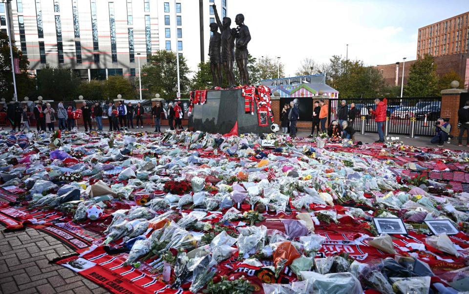 Flowers are placed alongside the scarves