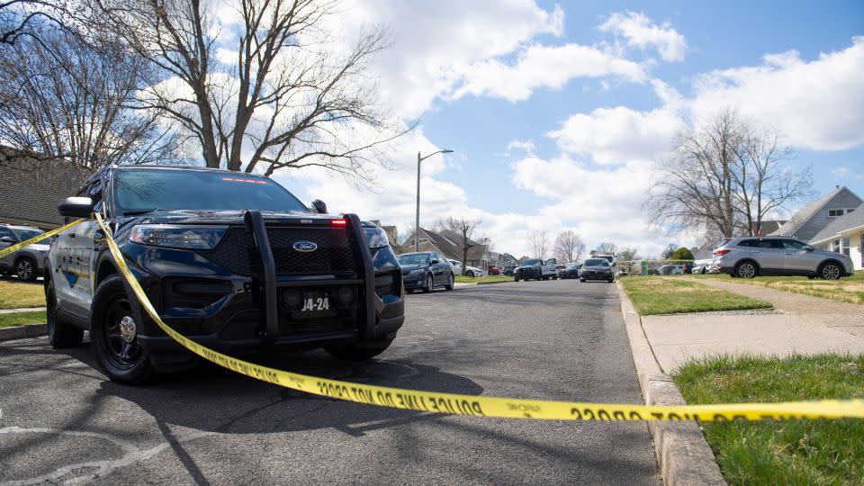 Police officers from the Falls Township Police Department inspect the scene of a shooting in the Vermillion Hills neighborhood on March 16, 2024, in Levittown, Pennsylvania. - Matthew Hatcher/Getty Images