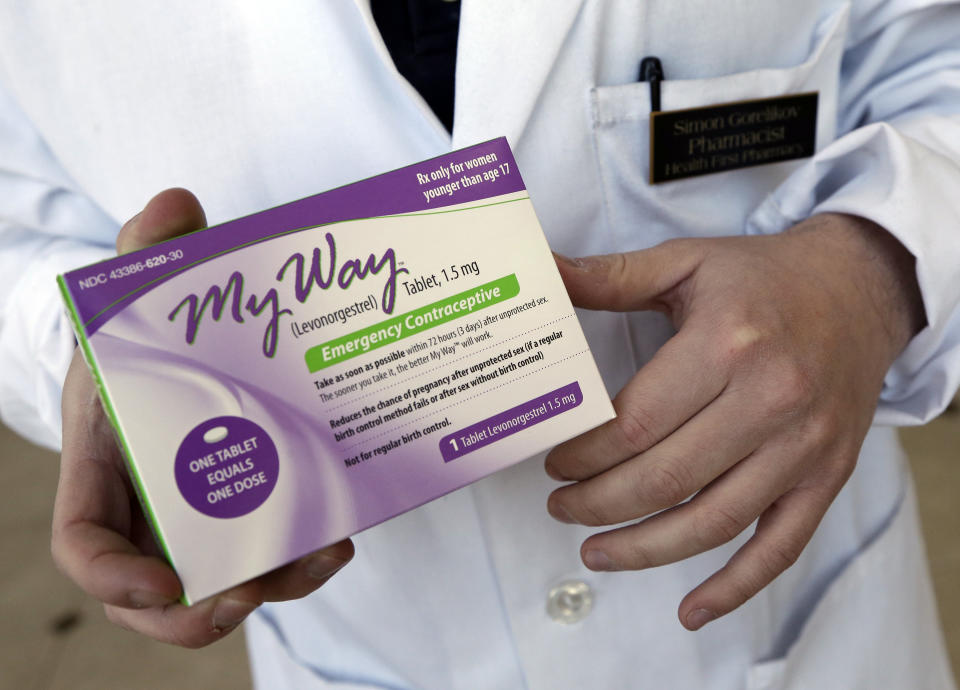 This Thursday, May 2, 2013 photo shows pharmacist Simon Gorelikov holding a generic emergency contraceptive at the Health First Pharmacy in Boston. New rules permitting 15-year-olds to get the morning-after pill without a prescription are being debated by teens as well as adults, with some saying it will help kids who can't confide in an adult, while others say the lower age infringes on a parent's right to know what's going on. (AP Photo/Elise Amendola)