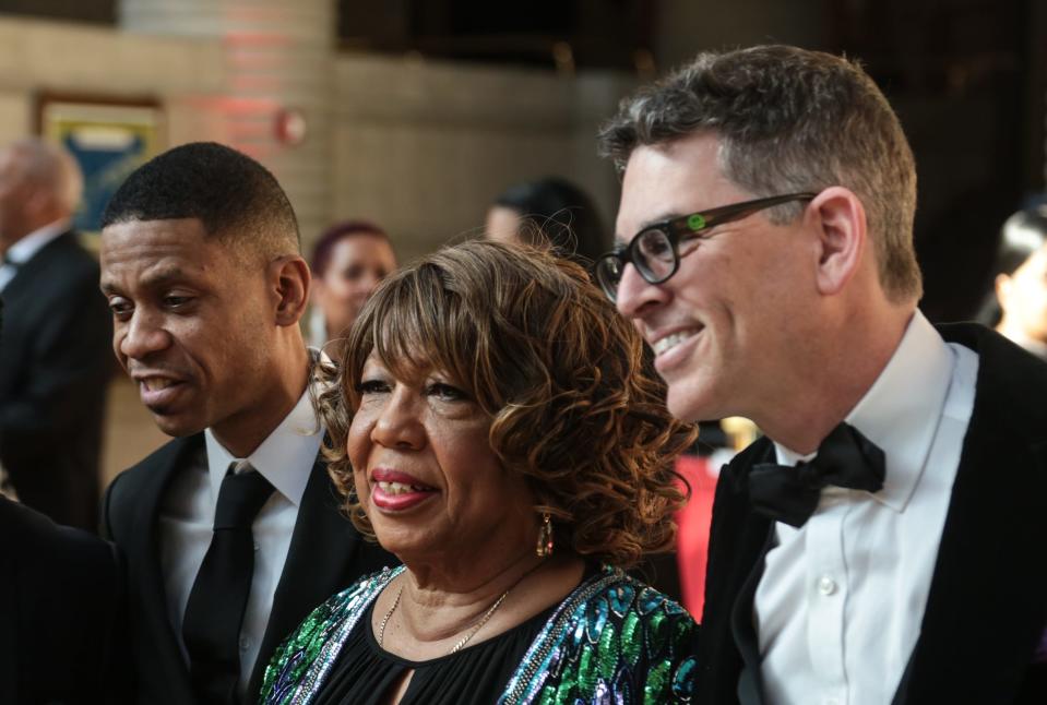 From left, Kecalf Franklin, son of Aretha Franklin, Earline Franklin and Amazing Grace producer Alan Elliott pose for a photo at the Charles H. Wright Museum in Detroit on March 25, 2019 ahead of a screening of Aretha Franklin's gospel movie.