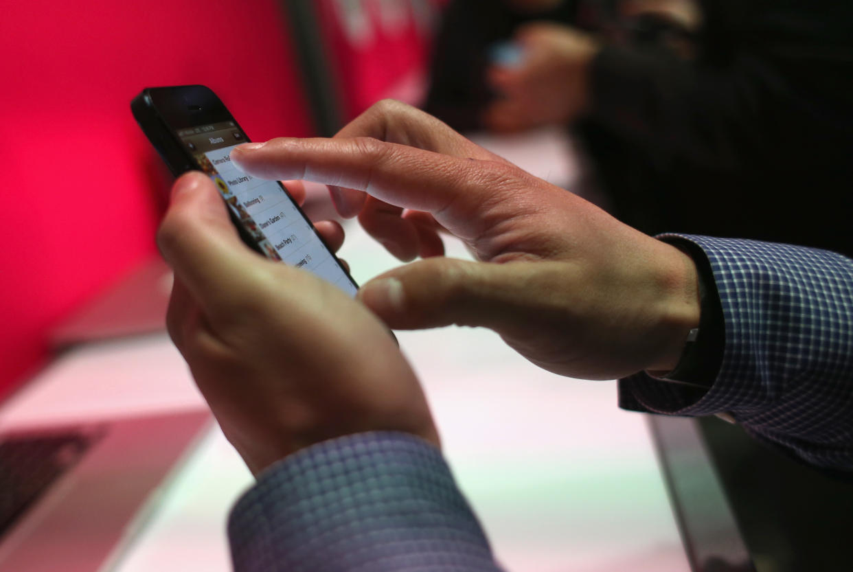 A T-Mobile connected iPhone is shown on display in New York City. (Photo by John Moore/Getty Images)