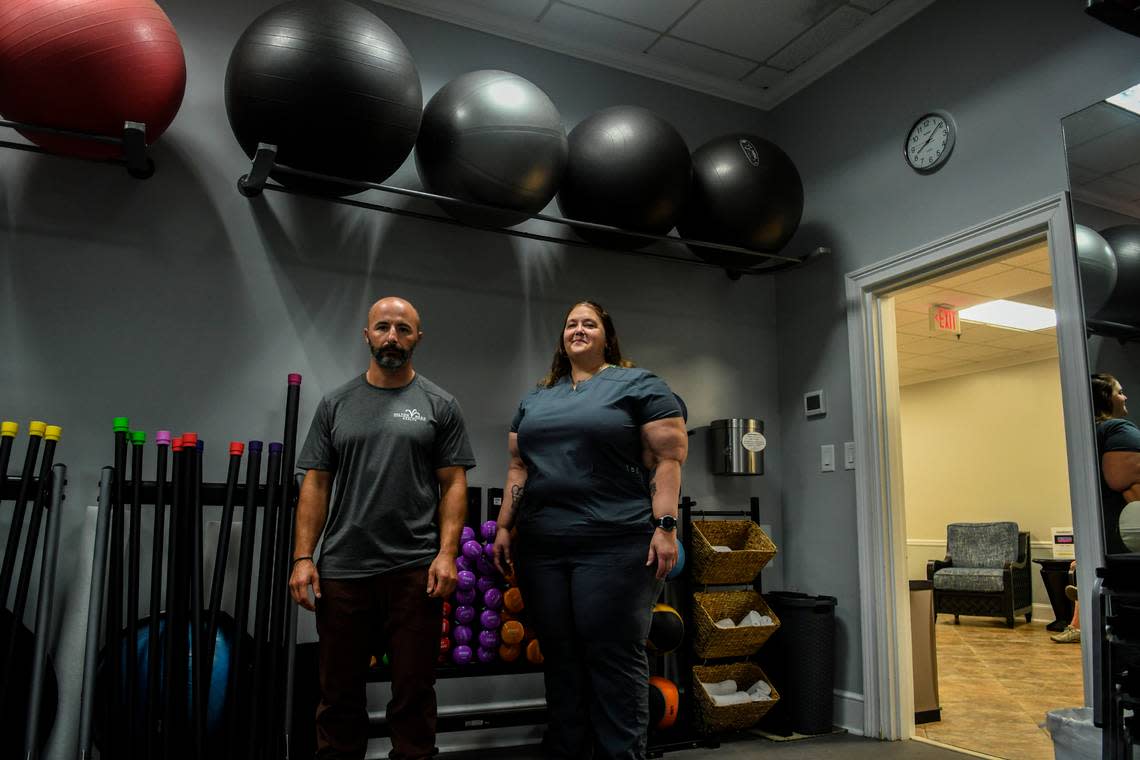 Hilton Head Health’s trainer Matt Barrack, left and massage therapist Rachel Sharp both benefit from the wellness resort’s employee-assisted housing, the two photographed in the fitness center on Thursday, Aug. 18, 2022 on Hilton Head Island. The resort’s owner has bought island properties, rehabbed them and rents them to his employees at affordable rates that allow them to live on the island.