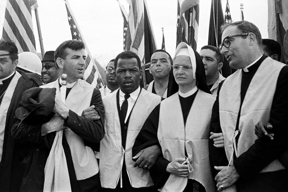At the head of the march from Selma to Montgomery on March 25, 1965, nuns, priests and civil rights leaders: The Rev. Arthur Matott (from left), John Lewis (head of the Student Nonviolent Coordinating Committee), Andrew Young, Sister Mary Leoline and Theodore Gill. (Photo: Stephen F. Somerstein via Getty Images)