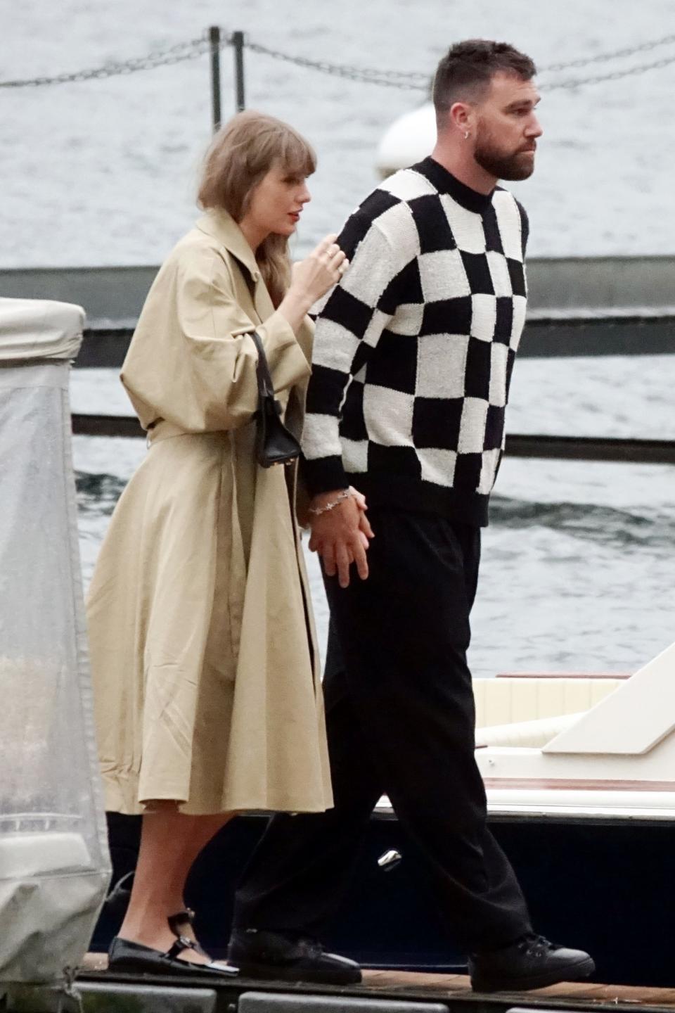 Taylor Swift and Travis Kelce in Lake Como where taylor swift wears a trench coat LBD and versace flats