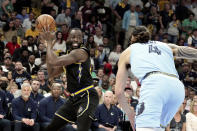 Golden State Warriors' Draymond Green (23) looks to pass as Memphis Grizzlies' Steven Adams (4) moves in during the first half of Game 5 of an NBA basketball second-round playoff series Wednesday, May 11, 2022, in Memphis, Tenn. (AP Photo/Karen Pulfer Focht)