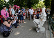 <p>An artist called “Aladin” takes part in the festival “Statues en Marche” in Marche-en-Famenne, Belgium, July 22, 2018. (Photo: Yves Herman/Reuters) </p>