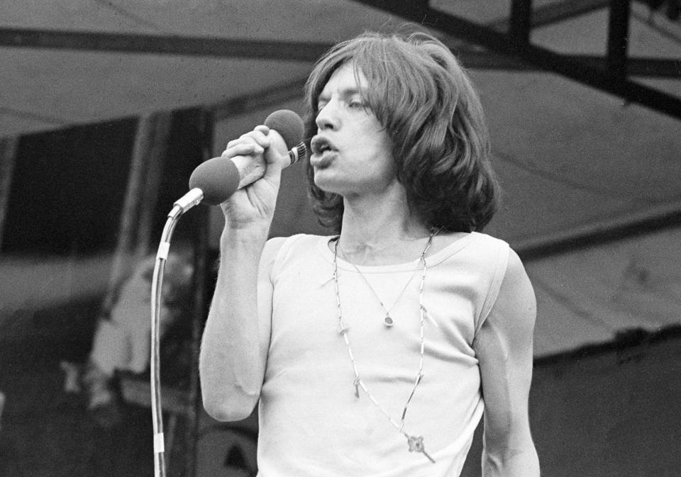 FILE - This Saturday, July 5, 1969 file photo shows Mick Jagger, lead singer of The Rolling Stones, singing during a free, five-hour concert before nearly 250,000 fans in Hyde Park in London, England. Handwritten letters from Rolling Stones frontman Mick Jagger to his former lover Marsha Hunt will be auctioned in London next month. Hunt is an American-born singer who was the inspiration for the Stones' 1971 hit "Brown Sugar" and bore Jagger's first child. Sotheby's says the "passionate and articulate" letters sent in the summer of 1969 show a "poetic and self-aware" 25-year-old Jagger. The auction house said Saturday Nov. 10, 2012 that the collection, which includes song lyrics and a Rolling Stones playlist, is expected to fetch between 70,000 and 100,000 pounds ($111,300 and $159,000) and will go under the hammer on December 12. (AP Photo/Peter Kemp) B/W ONLY