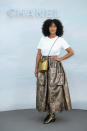 <p>For the Chanel haute couture show in Paris, Tracee Ellis Ross donned a simple tee with an oversized metallic skirt. The actress finished the look with co-ordinating cross-body bag and chunky boots. <em>[Photo: Getty] </em> </p>
