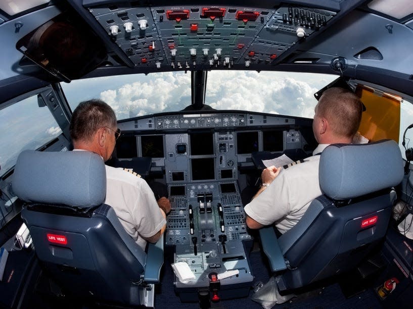 Pilots in a cockpit.