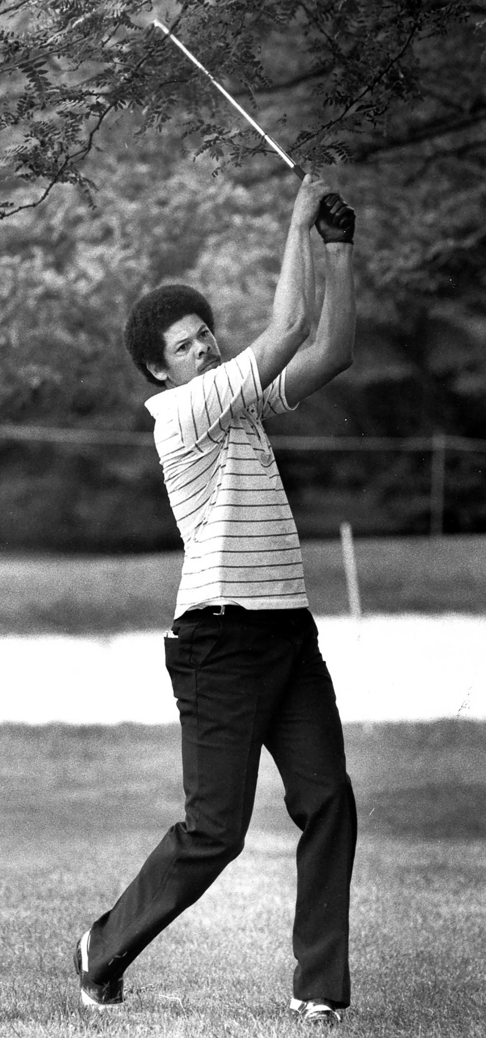 Cleveland Cavaliers legend Bingo Smith takes his approach shot from the tree line along the No. 13 fairway during the World Series of Golf Pro-Am on Aug. 23, 1982.