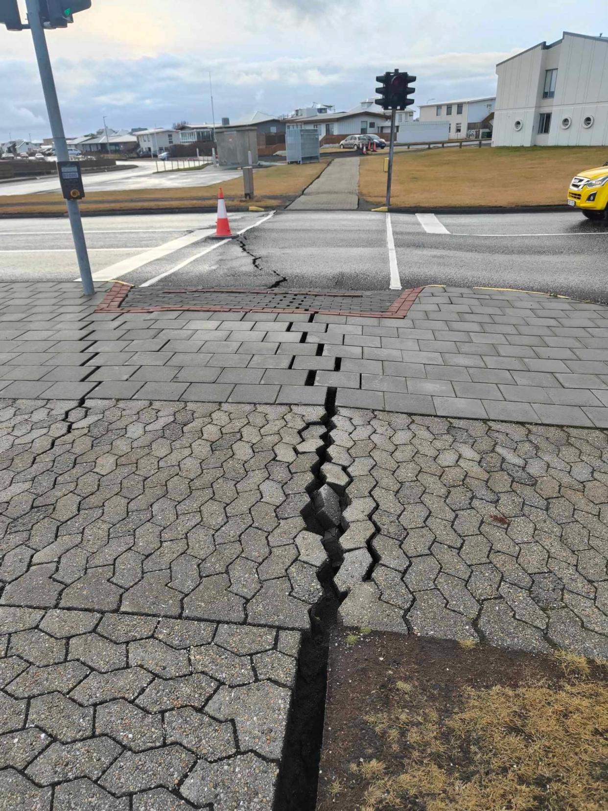 Cracks emerge on a road due to the volcanic activity in Grindavik (via REUTERS)