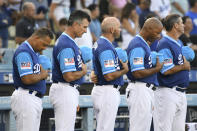 <p>Los Angeles Dodgers coaching staff stand for a moment of silence for deceased Senator John McCain before a baseball game against the San Diego Padres, Saturday, Aug. 25, 2018, in Los Angeles. (Photo: Michael Owen Baker/AP) </p>