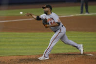 Baltimore Orioles relief pitcher Cesar Valdez (62) pitches in the ninth inning of a baseball game against the Miami Marlins, Tuesday, April 20, 2021, in Miami. (AP Photo/Marta Lavandier)
