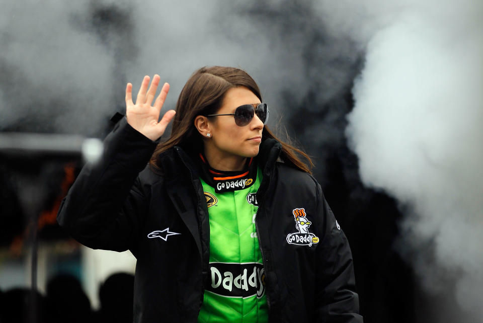DAYTONA BEACH, FL - FEBRUARY 26: Danica Patrick, driver of the #10 GoDaddy.com Chevrolet, waves to fans during driver introductions prior to the start of the NASCAR Sprint Cup Series Daytona 500 at Daytona International Speedway on February 26, 2012 in Daytona Beach, Florida. (Photo by Streeter Lecka/Getty Images)