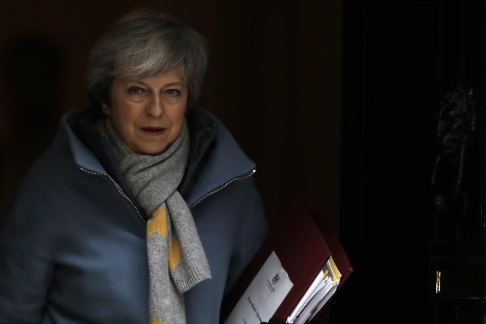 Britain's Prime Minister Theresa May leaves from Downing Street in London, Wednesday, March 13, 2019. European Union officials on Wednesday criticized the U.K. Parliament for rejecting a Brexit deal for a second time as the bloc prepared for a chaotic, cliff-edge departure. (AP Photo/Matt Dunham)