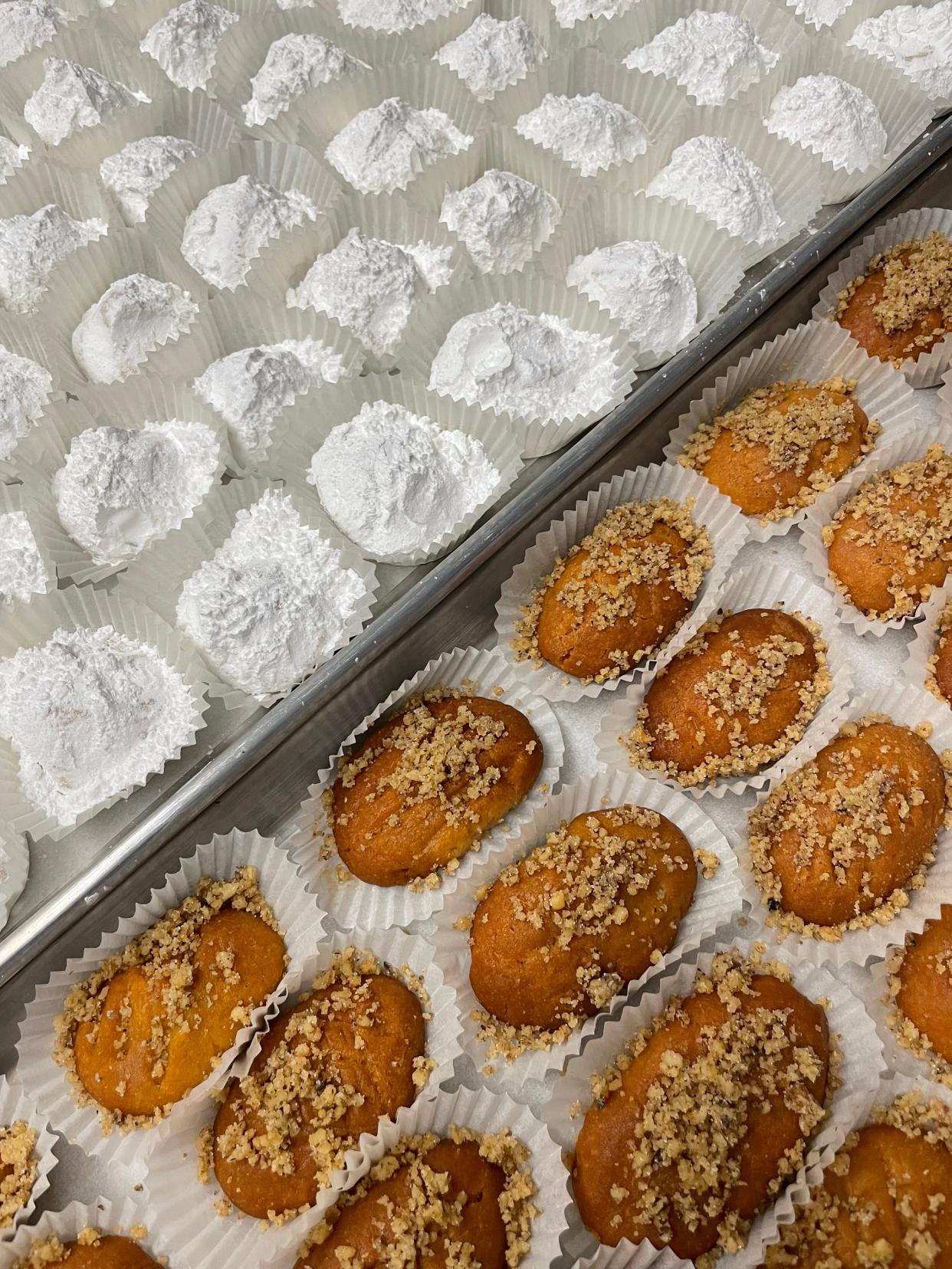 Kourambiethes, top, a butter cookie covered in powdered sugar, and finikia, a cookie dipped in syrup and topped with nuts, will be sold at the Greek Easter bake sale at Annunciation Greek Orthodox Church in Akron April 5  and 6.