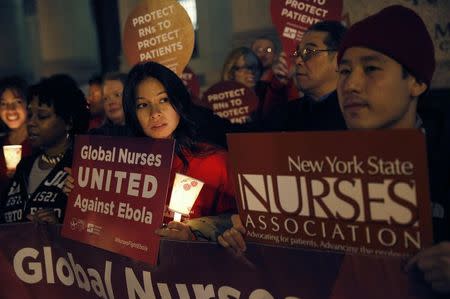 Nurses from the New York State Nurses Association protest for improved Ebola safeguards, part of a national day of action, in New York City November 12, 2014. REUTERS/Mike Segar