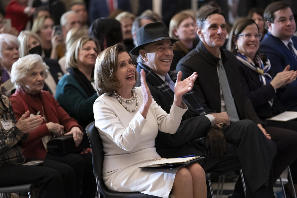 Speaker of the House Nancy Pelosi, D-Calif., is joined by her family and husband Paul Pelosi as they attend her portrait unveiling ceremony in Statuary Hall at the Capitol in Washington, Wednesday, Dec. 14, 2022. (AP Photo/J. Scott Applewhite)