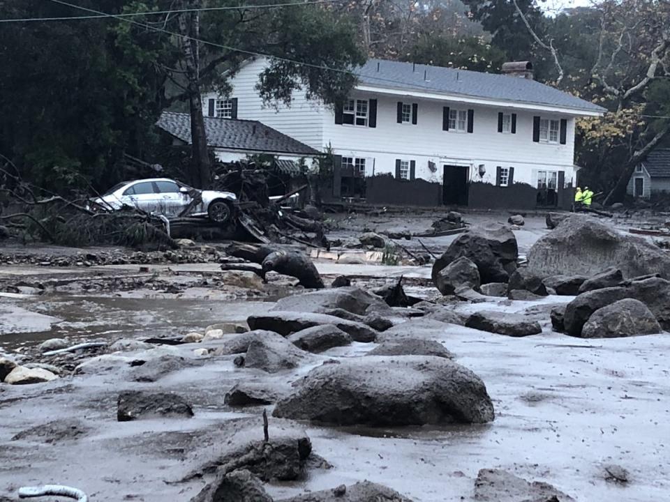 <p>Scene from the 300 block of Hot Springs Road in Montecito, Calif., following debris and mud flow due to heavy rain on Jan. 9, 2018. (Photo: Mike Eliason/Santa Barbara County Fire Department via Twitter) </p>