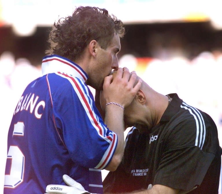 French defender Laurent Blanc kisses the head of goalkeeper Fabien Barthez at the 1998 World Cup