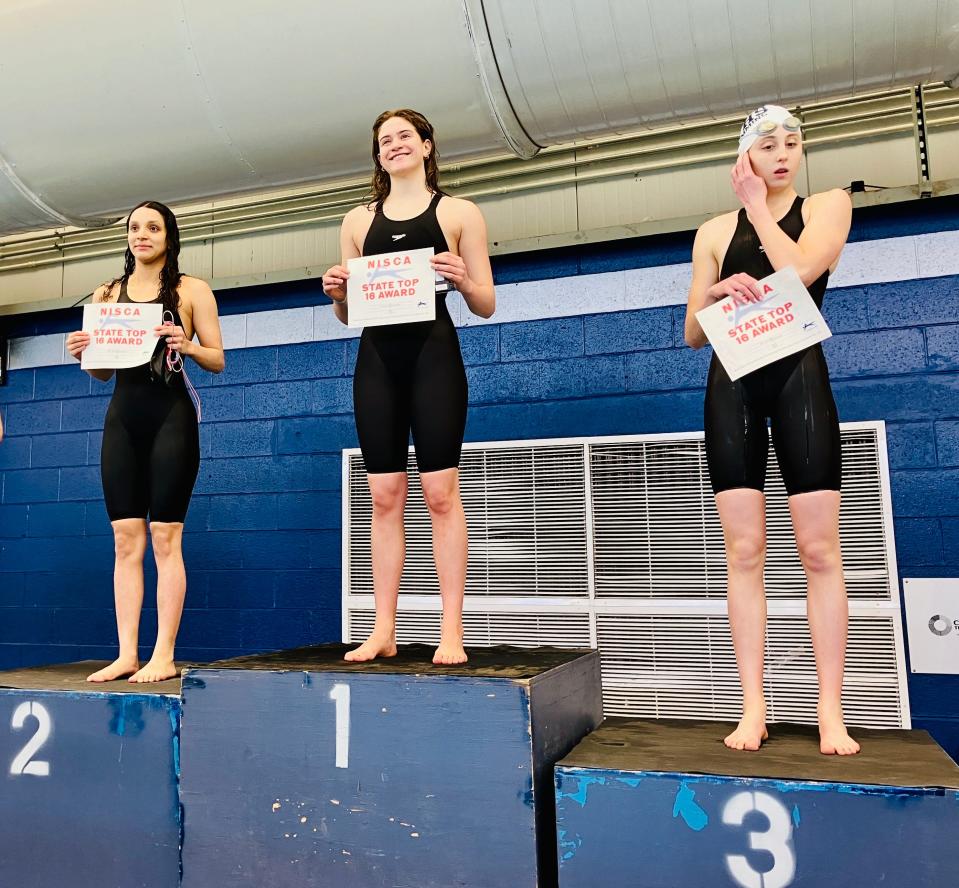 Wayne Valley's Sarah Rodrigues (middle) captured the state swimming title in the backstroke at the Meet of Champions on March 3, 2024.